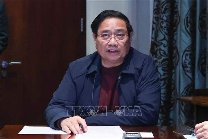 Thủ tướng Phạm Minh Chính chủ trì họp trực tuyến từ Nam Phi, chỉ đạo khắc phục hậu quả mưa lũ. Ảnh: Dương Giang/TTXVN Thủ tướng Phạm Minh Chính chủ trì họp trực tuyến từ Nam Phi, chỉ đạo khắc phục hậu quả mưa lũ. Ảnh: Dương Giang/TTXVN