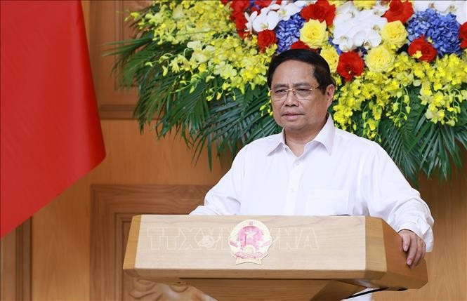 Thủ tướng Phạm Minh Chính chủ trì họp triển khai giải pháp khắc phục hậu quả bão số 10. Ảnh: Dương Giang/TTXVN